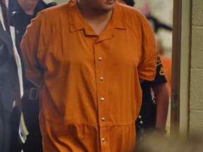 Todd Kohlhepp enters the courtroom of Judge Jimmy Henson for a bond hearing at the Spartanburg Detention Facility, in Spartanburg, S.C., Sunday, Nov. 6, 2016. The judge denied bond for Kohlhepp, charged with a 2003 quadruple slaying and more recently holding a woman captive on his property. (AP Photo/Richard Shiro)