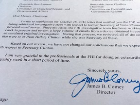Part of a Nov. 6, 2016, letter from FBI director James Comey to Congress is photographed in Washington, Sunday, Nov. 6, 2016. Comey tells Congress that a review of new Hillary Clinton emails has "not changed our conclusions" from earlier this year that she should not face charges. (AP Photo/Jon Elswick)