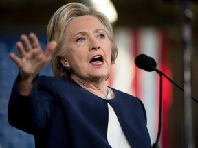 In this Nov. 4, 2016, photo, Democratic presidential candidate Hillary Clinton speaks at a rally at Eastern Market in Detroit. If she gets to the White House, Clinton has a daunting to-do list. And it's made more complicated because she's laid out some very specific promises. (AP Photo/Andrew Harnik)