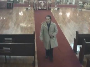 New York police are looking for a suspect who allegedly walked out of a Brooklyn cathedral with a four-foot-tall scepter. The theft was caught on surveillance video. (Screen Capture)