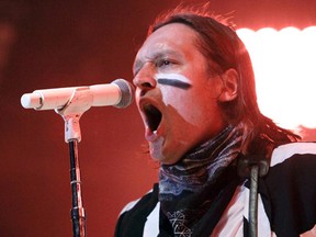 Win Butler of Arcade Fire sings during the band’s concert at Jean Drapeau Park in Montreal Saturday, August 30, 2014. (Postmedia Network file photo)
