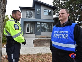 Members of the infill compliance team, Peace Officer Darren Anderson (L) and James Bailey, compliance officer, are part of the infill compliance team launched in July in response to citizen complaints in Edmonton, Thursday, October 13, 2016. Ed Kaiser/Postmedia