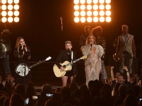 Beyonce (right) performs onstage with Emily Robison and Natalie Maines of Dixie Chicks at the 50th annual CMA Awards at the Bridgestone Arena on November 2, 2016 in Nashville, Tennessee. (Photo by Rick Diamond/Getty Images)