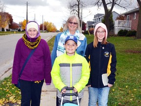 Since their PA day was a little cold and gray Nov. 4, Amberleigh, Bradley and Heather Dearing decided to go for a walk with their grandmother, Liz Dore, to the West Perth Public Library to take out some new books. GALEN SIMMONS MITCHELL ADVOCATE