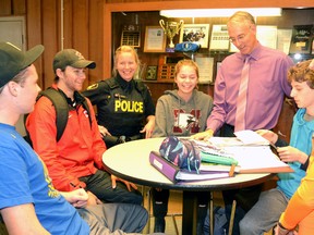 Mitchell District High School's (MDHS) new vice principal, Ian Moore, used to work with the OPP's new youth resource officer assigned to MDHS, CP Julie McLeod, back when they both worked at St. Marys DCVI a few years ago. Pictured, Moore introduces McLeod to some of the students at MDHS, from left, Alec Murray, Cody Pauli, McLeod, Moore, Sara McLaughlin, Neil Leslie-Tesluk and Julia Harmer. GALEN SIMMONS MITCHELL ADVOCATE