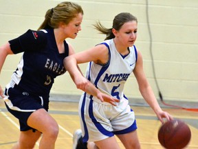 Kayla Bublitz keeps fends off a St. Anne's player as she dribbles down court during a senior girls basketball quarter-final playoff game at Mitchell District High School last Wednesday, Nov. 2, a 33-25 victory. GALEN SIMMONS MITCHELL ADVOCATE