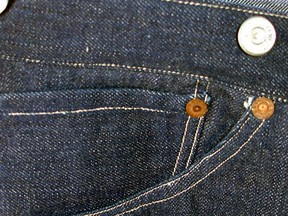 This undated photo provided by Daniel Buck Auctions & Appraisals shows the right front pocket on a pair of 1893 Levi-Strauss denim blue jeans in pristine condition that will go up for auction Saturday, Nov. 5, 2016 in Lisbon Falls, Maine. The auction house said the jeans were ordered for Solomon Warner, a businessman and pioneer who participated in the creation of the Arizona Territory. Warner wore them only a few times before falling ill. He died in 1899. (Daniel Buck Auctions & Appraisals via AP)