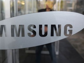 A shareholder of Samsung Electronics arrives for the general meeting of shareholders in Seoul, South Korea, Thursday, Oct. 27, 2016. Samsung Electronics reported a sharp fall in its quarterly earnings Thursday as the unprecedented recall and discontinuation of the Galaxy Note 7 smartphones wiped out its mobile profit. (AP Photo/Lee Jin-man)