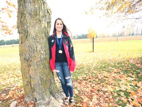 Teegan McGavin, 16, from Walton sports the silver medal for a jazz formation and a modern formation gold medal she won at the 2016 IDO World Championships in Germany last month.(Shaun Gregory/Huron Expositor)