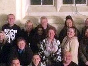 An eerie face decided to join a photo op after a haunted Halloween tour of the Newsham Park Hospital in England. (Facebook/Haunted Happenings Official Page)