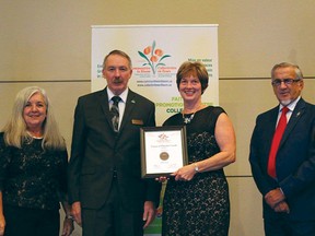 Pincher Creek was awarded a 5 Blooms Bronze rating and a certificate of honourable mention. Diane Burt Stuckey received the certificate during the Communities in Bloom awards ceremony in Regina, Sask. | Photo courtesy of Communities in Bloom Facebook