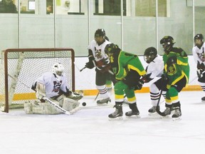 Hawk goaltender Brody Grant makes a save.