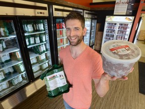 Nick Post shows some of his raw dog food products at the Post RAW store on Oxford St. and Gammage. The line offers a more natural diet for dogs. (MORRIS LAMONT, The London Free Press)
