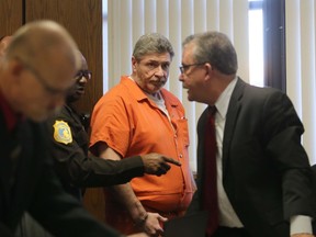 Charles Pickett Jr., center, arrives for a preliminary examination before Judge Vincent Westra in Kalamazoo County District Court Monday, Nov. 7, 2016. Picket is charged with multiple murder and reckless driving felonies for the June 7 North Westnedge Avenue crash where he drove into nine bicyclists. (Mark Bugnaski/Kalamazoo Gazette-MLive.com via AP)