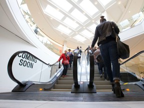 Patrons ride on an escalator at Masonville Place as the space formerly occupied by Sears, which has undergone an extensive renovation, is opened at the north end shopping centre in London, Ont. on Friday November 4, 2016. (CRAIG GLOVER, The London Free Press)