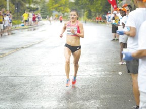 Lanni Marchant, shown competing in an Ottawa race in May, made Canadian history with her performance in Sunday?s New York City marathon and says she hopes Athletics Canada becomes ?more reasonable? with rankings. (Postmedia News photo)