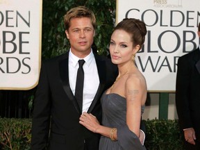 In this Jan. 15, 2007, file photo, actor Brad Pitt and actress Angelina Jolie arrive for the 64th Annual Golden Globe Awards in Beverly Hills, Calif. Angelina Jolie Pitt and estranged husband Brad Pitt have reached a custody agreement regarding their six children, according to a statement released by a representative of the actress Monday, Nov. 7, 2016. (AP Photo/Mark J. Terrill, File)