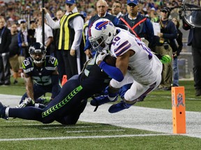 Bills wide receiver Robert Woods (10) is pushed out-of-bounds at the goal line by Seahawks outside linebacker Brock Coyle during NFL action in Seattle on Monday, Nov. 7, 2016. (John Froschauer/AP Photo)