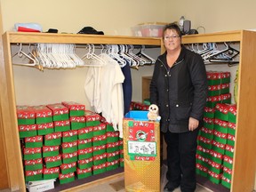 Betty Tousignant stands besides some of the filled and empty boxes for the annual Operation Christmas Child Project. People are still invited to pick up a box by calling 705-272-1609 and fill it with various items  to make a young child happy this Christmas.