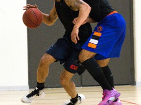 The London Lightning'snewest team member Joel Friesen dribbles past Julian Boyd during practice at the downtown YMCA in London, Ont. on Tuesday November 8, 2016. Derek Ruttan/The London Free Press/Postmedia Network