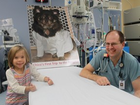 Bluewater Health has thrown its support behind local children's author Jen Dafoe in her efforts to develop her book, Chico's First Trip to the Hospital. Pictured are Dafoe's five year-old 'spokesperson' Nora McLaughlin and Dr. Jim Grochowski in a pediatric room in the Sarnia hospital's emergency department. 
CARL HNATYSHYN/SARNIA THIS WEEK