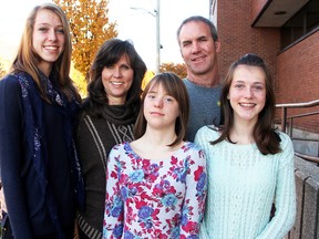 Sydney Vrolyk, 17, centre, is pictured with her sisters Paige, 15, left, and Abby, 13, her dad John, and her mom Helen Van Sligtenhorst. Vrolyk has Down syndrome. Tyler Kula/Sarnia Observer/Postmedia Network