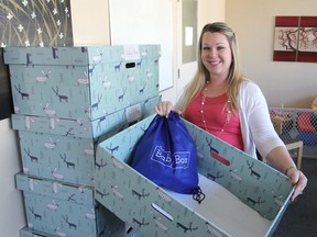 Elizabeth Sacrey, executive director of the Kingston Pregnancy Care Centre in Kingston, shows some of the centre's new Baby Boxes, cardboard boxes intended to provide a safe sleeping environment for newborn babies. They are being handed out for free. (Michael Lea/The Whig-Standard)