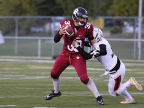 Quade Kozak’s size, strong arm and growing game experience will be put to a severe test Saturday when the Bellerose Bulldogs face the perfect-record Bev Facey Falcons in a Division I high school regional semi-final. Shown here against the Salisbury Sabres in an early-season victory, Kozak has thrown for 11 touchdowns and more than 1,100 total yards through the air while using his 215-pound frame as an asset in the ground game, as well. (Photo courtesy Shelley Cowan)
