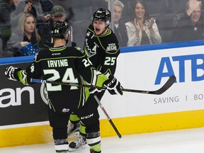 Lane Bauer, shown here celebrating a goal with teammate Aaron Irving In October, says the Oil Kings win against Swift Current to start the road trip gave the team a boost. (Ian Kucerak)