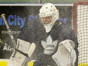 New London Nationals goalie Cam Zanussi tries to locate the puck in a snow shower during practice on Tuesday. Derek Ruttan/The London Free Press
