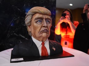 A cake in the likeness of Republican presidential nominee Donald Trump is on display at his election night event at the New York Hilton Midtown in New York on November 8, 2016. 
Millions of Americans turned out Tuesday to decide whether to send Democrat Hillary Clinton to the White House as their first woman president or to put their trust in Republican maverick populist Donald Trump. / AFP PHOTO / Timothy A. CLARYTIMOTHY A. CLARY/AFP/Getty Images