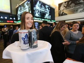 Zoe George helps with beverages as Molson Coors Canada and MLSE unveil the Air Canada Centre's new Draught Deck Tuesday November 8, 2016. (Stan Behal/Toronto Sun)