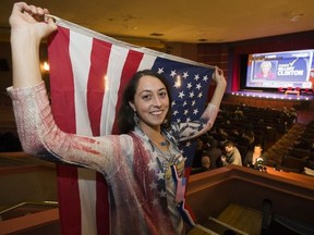 U.S. citizen Mary Catherine E. Lawler watches the U.S. election results during the American't event at the Garneau Theatre, 8712 - 109 St., in Edmonton on Tuesday Nov. 8, 2016.  Photo by David Bloom