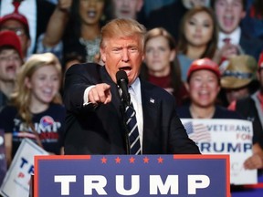 Donald Trump speaks at a campaign rally in Grand Rapids, Mich., Tuesday, Nov. 8, 2016. (AP Photo/Paul Sancya)