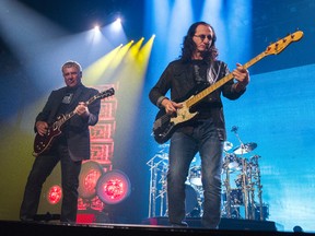 Rush guitarist Alex Lifeson (left) and bassist Geddy Lee perform during the R40 Live 40th Anniversary Tour at Rogers Arena in Vancouver July 17 2015. (Postmedia Network file photo)