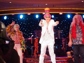 Performer and Cruise Director Eric De Gray, centre, hams it up on stage during a show aboard the Azamara Journey. (PHOTO COURTESY OF MICHELLE GRAHAM PHOTOGRAPHY)