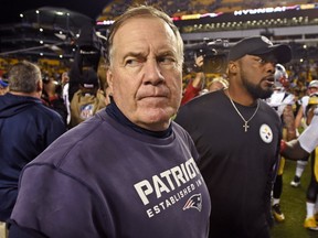 New England Patriots head coach Bill Belichick, left, heads to his locker room after shaking hands with Pittsburgh Steelers head coach Mike Tomlin following an NFL football game in Pittsburgh, Sunday, Oct. 23, 2016. (AP Photo/Don Wright)