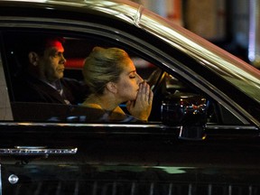 Musician Lady Gaga sits in her car after staging a protest against Republican presidential nominee Donald Trump outside Trump Tower in New York City after midnight on election day November 9, 2016. Donald Trump stunned America and the world, riding a wave of populist resentment to defeat Hillary Clinton in the race to become the 45th president of the United States. The Republican mogul defeated his Democratic rival, plunging global markets into turmoil and casting the long-standing global political order, which hinges on Washington's leadership, into doubt. (DOMINICK REUTER/AFP/Getty Images)