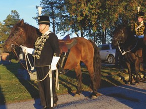 Troop Sgt. Steve Hartwick of the 1st Hussars holds a riderless horse Sunday at a Celebration of Life ceremony for the late Private Kenneth Donald Duncanson at the Fairview Cemetery just outside of Dutton. Born in Wallacetown, he fought for the Algonquin Regiment, Canadian Army in the Second World War. He was killed in battle while crossing abridge but his body was never found until 2014 when someone with a metal detector found objects traced back to him. He was buried in Belgium and a service of remembrance held at the family gravesite. The missing rider on a horse is Cavalry tradition at funerals and the boots turned backward symbolize the fact he will never ride again. The service was held at the conclusion of the Military Heroes weekend in Dutton.