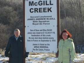 Landowner Carole Kilfoyle (left) and Hollan Legion member Tamara Greenlay with the sign honouring James Andrew McGill at McGill Creek. (SUPPLIED PHOTO)