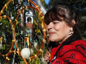Luke Hendry/tHE Intelligencer
Artist Lola Lawton of Flinton, ON. stands in front of a dreamcatcher she made Wednesday. She was part of a social-justice group that met with Bay of Quinte MP Neil Ellis in Belleville to express several concerns. Lawton said she designed the dreamcatcher as a way of symbolizing open discussion and unity.