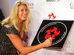 Silken Laumann signs her plaque as she was inducted into Canada's Walk of Fame at the Sony Centre in Toronto last November. 
Michael Peake/Postmedia Network