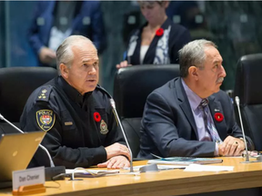 Police Chief Charles Bordeleau (L) and Councillor Eli El-Chantiry present the police budget as councillors take part in the City of Ottawa's draft 2017 Budget being tabled at City Hall. (Wayne Cuddington, Postmedia)