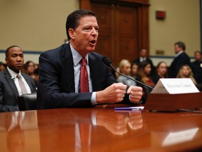 In this Sept. 28, 2016, file photo, FBI Director James Comey testifies on Capitol Hill in Washington. Comey is facing a complicated path under a Donald Trump administration. Does he try to serve out the remaining seven years of his term under a president who has questioned the FBI's integrity? Or does he stay on as a safeguard against executive power? (AP Photo/Pablo Martinez Monsivais, File)