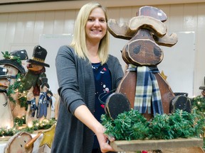 Lauren Reaman holds up a wooden Christmas moose sculpture that was on sale during the 13th annual OSAID County Christmas Craft Show Saturday, Nov. 3, at the Goderich District Collegiate Institute. Around 1,500 people peruse hundreds of handmade items during this annual sale, which unofficially kicks off the holiday shopping season here in Goderich. Proceeds from the day-long event go towards OSAID, which stands for Ontario Students Against Impaired Driving. (Darryl Coote/The Goderich Signal Star)