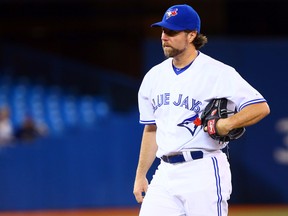 R.A. Dickey of the Toronto Blue Jays regroups after walking home a run against the Cleveland Indians during MLB action in Toronto on May 13, 2014. (Dave Abel/Toronto Sun)