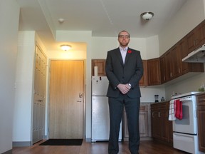 Josh Bode stands in his apartment at 77 Tecumseh Ave. W. in London, a recently built affordable housing unit featuring high ceilings, an open-concept kitchen and spacious balcony. ?It has everything I need,? said Bode. (DALE CARRUTHERS, The London Free Press)