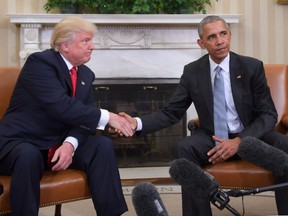 US President Barack Obama and President-elect Donald Trump shake hands during a transition planning meeting in the Oval Office at the White House on November 10, 2016 in Washington,DC.  (JIM WATSON/AFP/Getty Images)