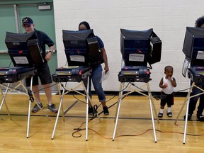 Voters cast their ballots at voting machines at Shadow Ridge High School on Election Day on November 8, 2016 in Las Vegas, Nevada. Americans across the nation are picking their choice for the next president of the United States. (Photo by Ethan Miller/Getty Images)