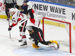 Senators goalie Mike Condon makes a glove save against the Buffalo Sabres on Nov. 9. (AP)